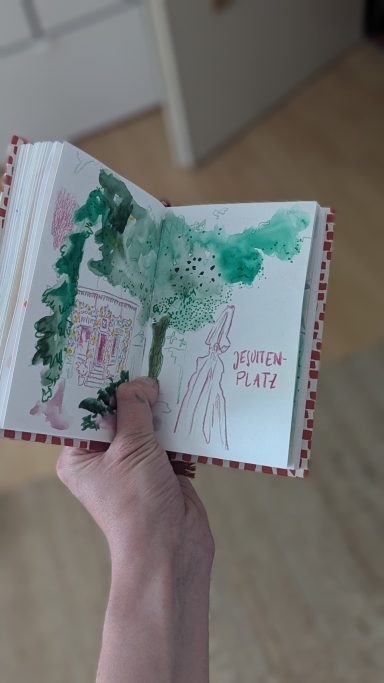 Baden-Baden: Jesuitenplatz Das Bild zeigt eine schnelle Skizze vom Jesuitenplatz in Baden-Baden. Blick auf einen Souvenirladen mit aufwendinger Dekoration.